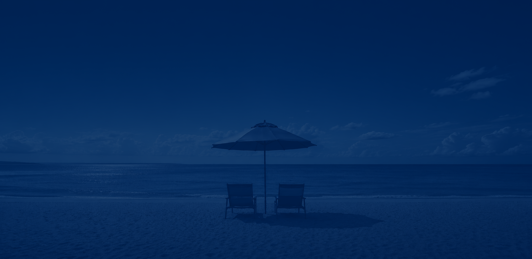Blue-toned beach scene with a small shaded hut by the sea